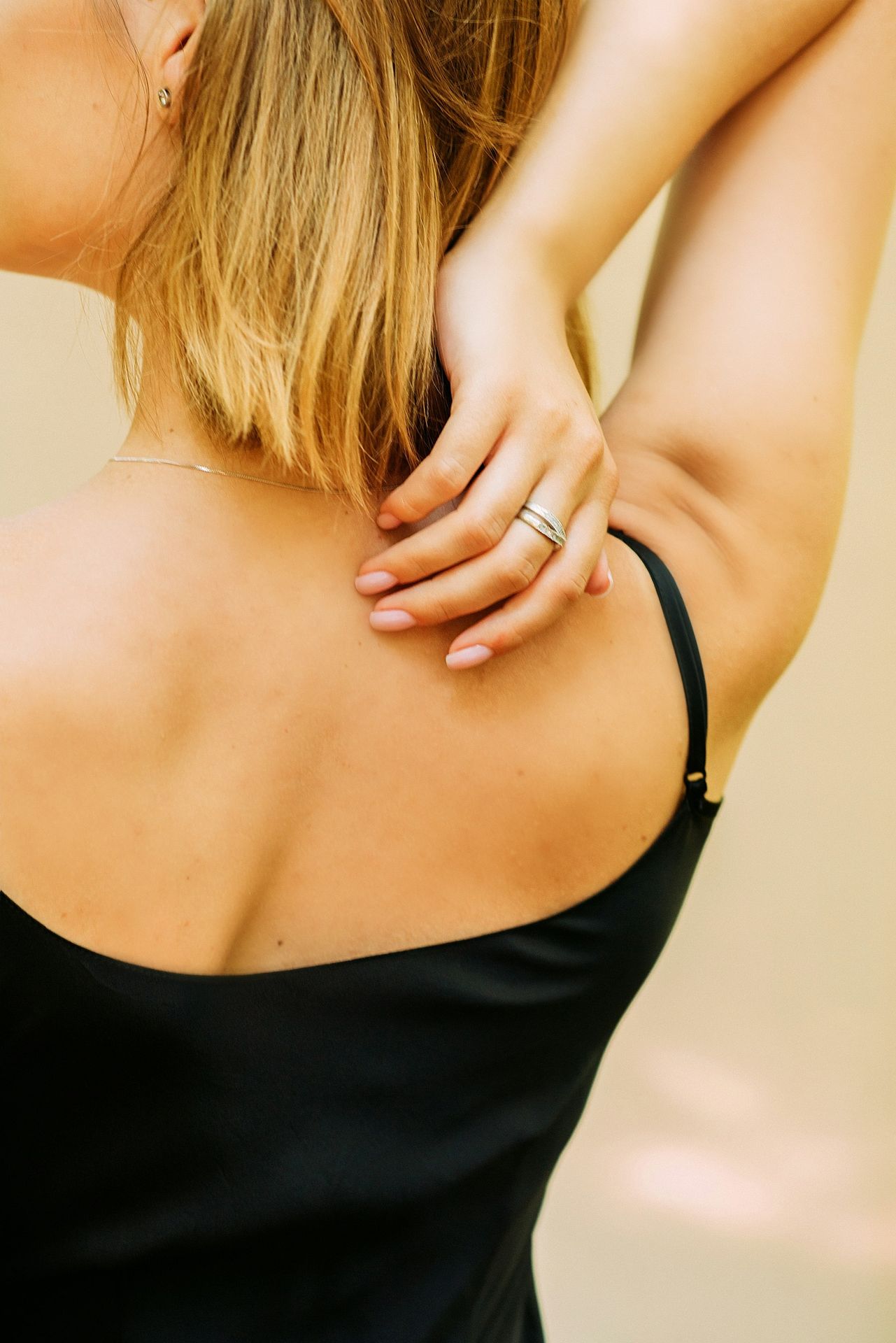 woman in black spaghetti strap top